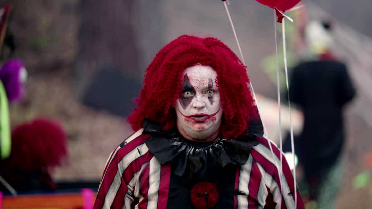 Creepy clown scare scene on a haunted trail
